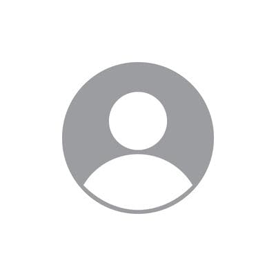 Silhouette blanche de tête et d'épaules à l'intérieur d'un cercle gris sur fond blanc.